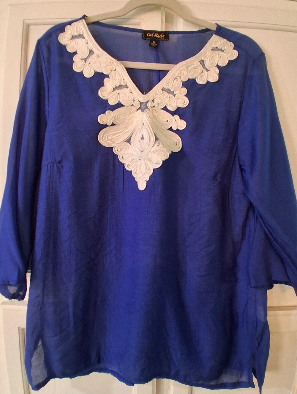 Cal Style tunic, striking white decorative embroidery along the neckline, sheer